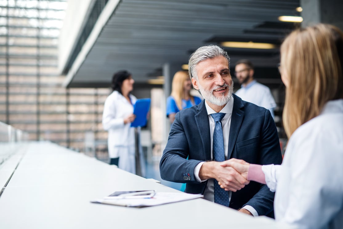 Doctors Talking to Pharmaceutical Sales Representative