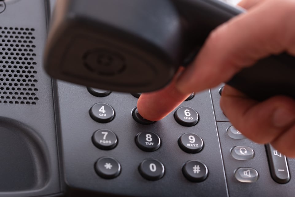 Finger Dialing a Phone Number on Landline Telephone